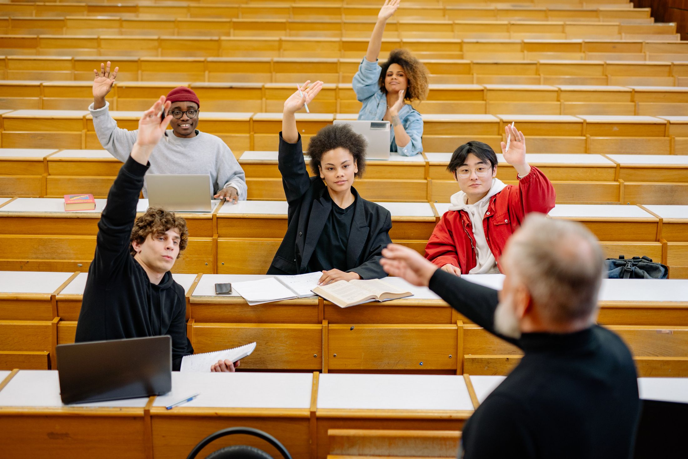 Adult students taking part in a classroom discussion